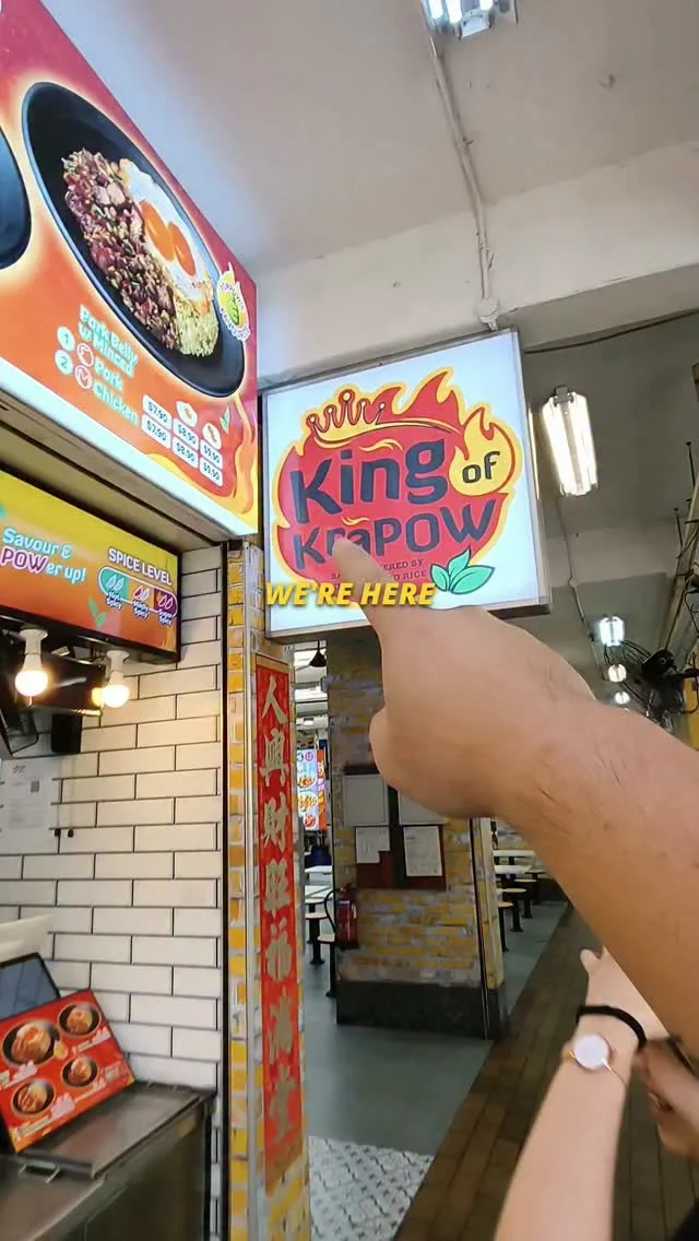 The King of KraPOW lightbox signboard and menu board at the Jurong West coffee shop